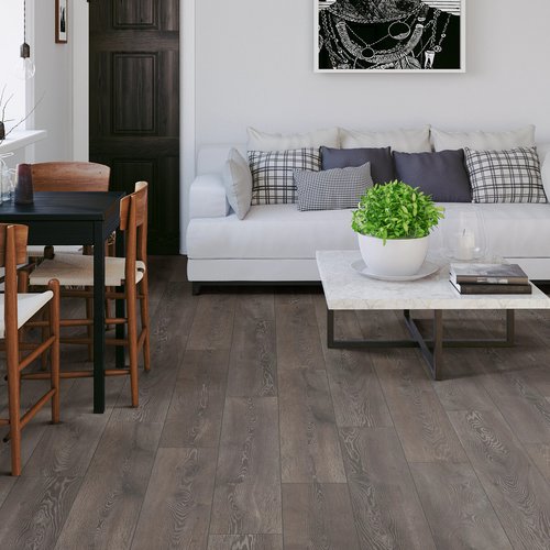 Living room with wood floor white couch desk and coffee table