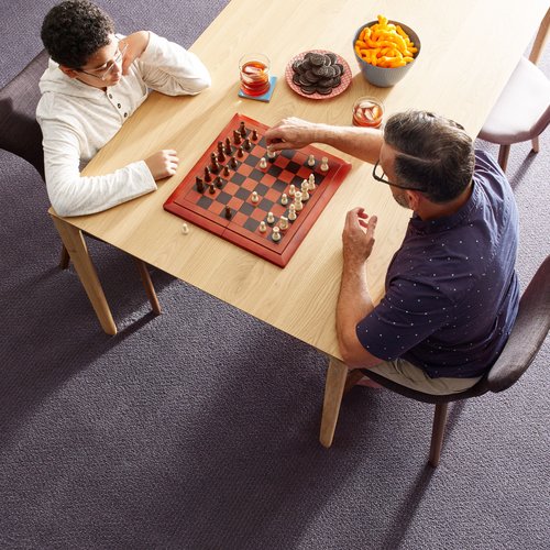 father and son playing chess